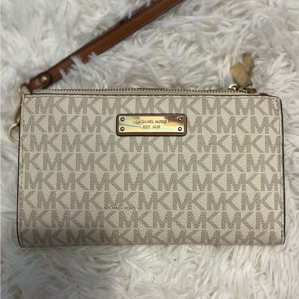 Brand new Michael Kors smartphone wristlet wallet.